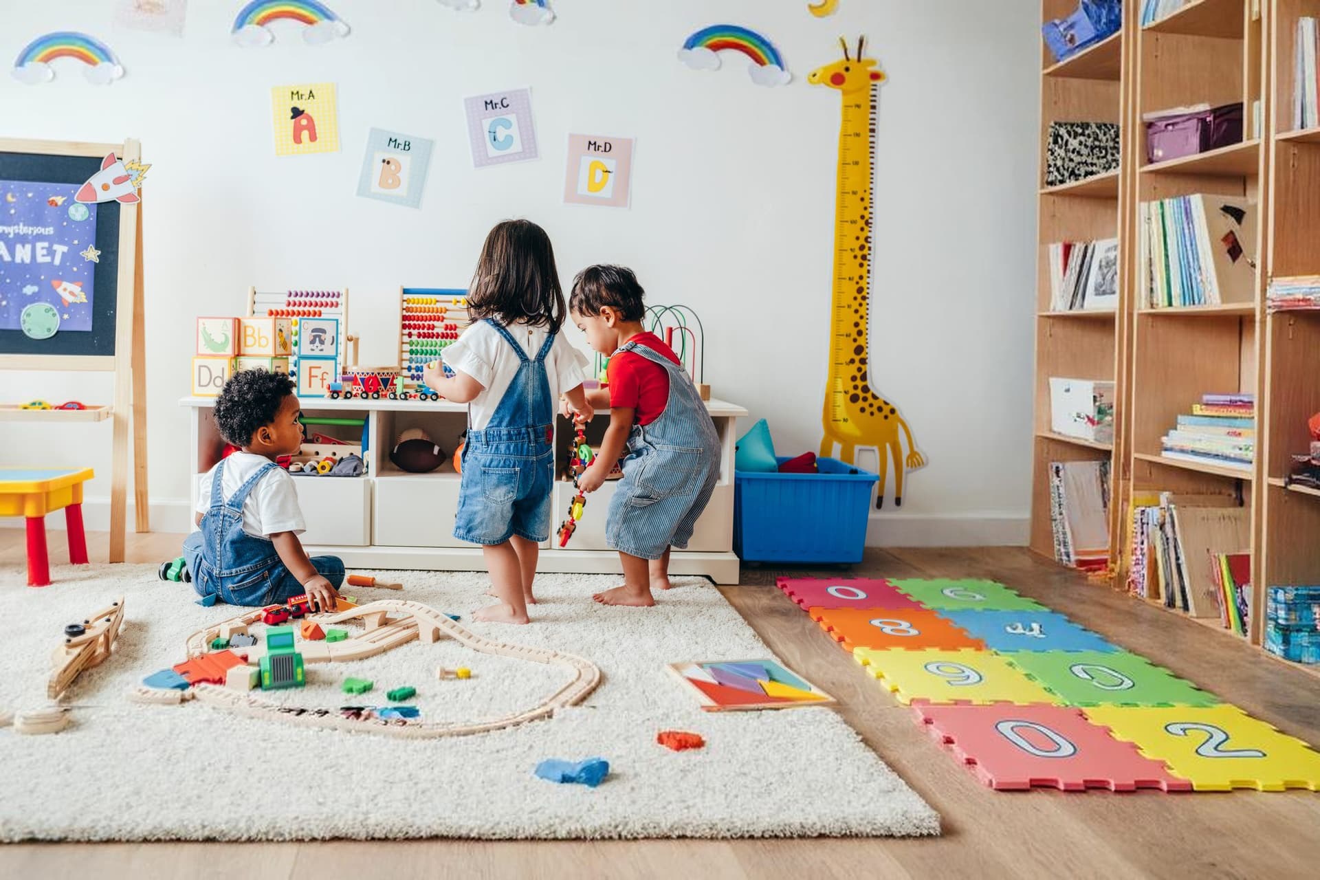 Toddlers playing in a colorful classroom